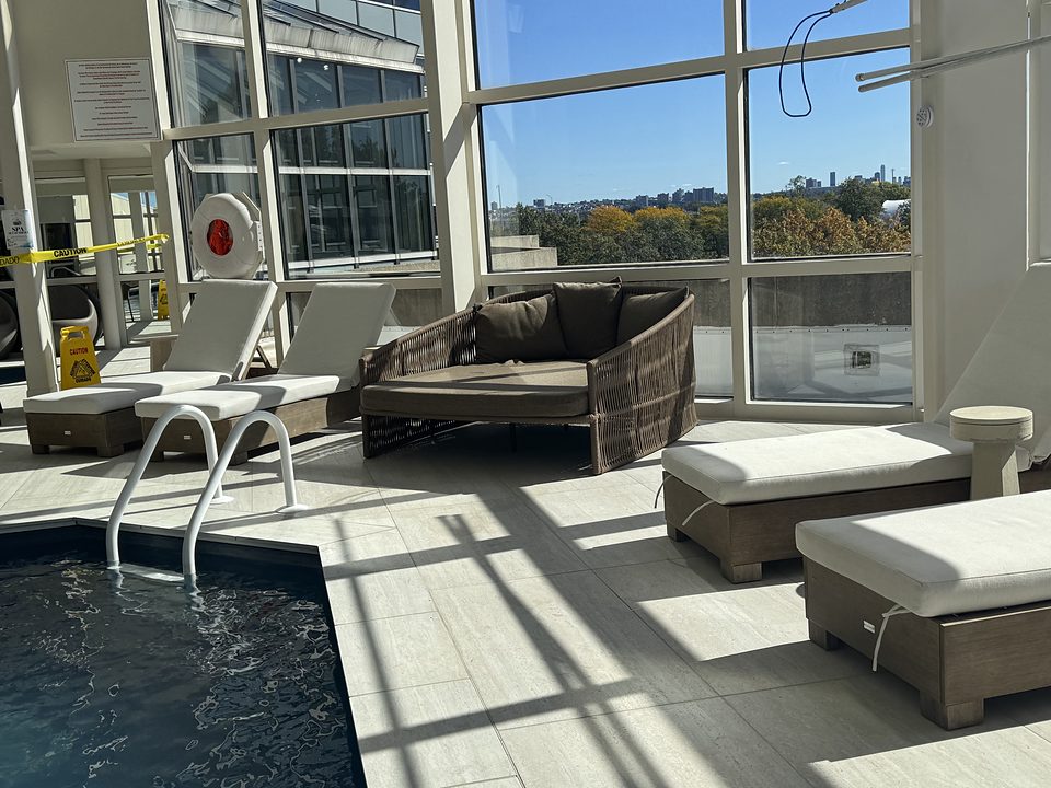 Lounge chairs by the pool in the afternoon sun